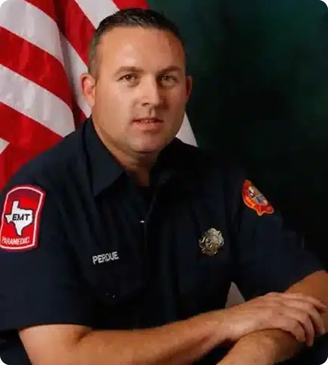 Philip Perdue, founder of Firefighter Roofing, in his DFW firefighter uniform
